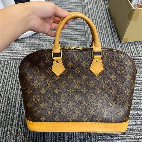 louis vuitton alma fake vs real|false louis vuitton prints.